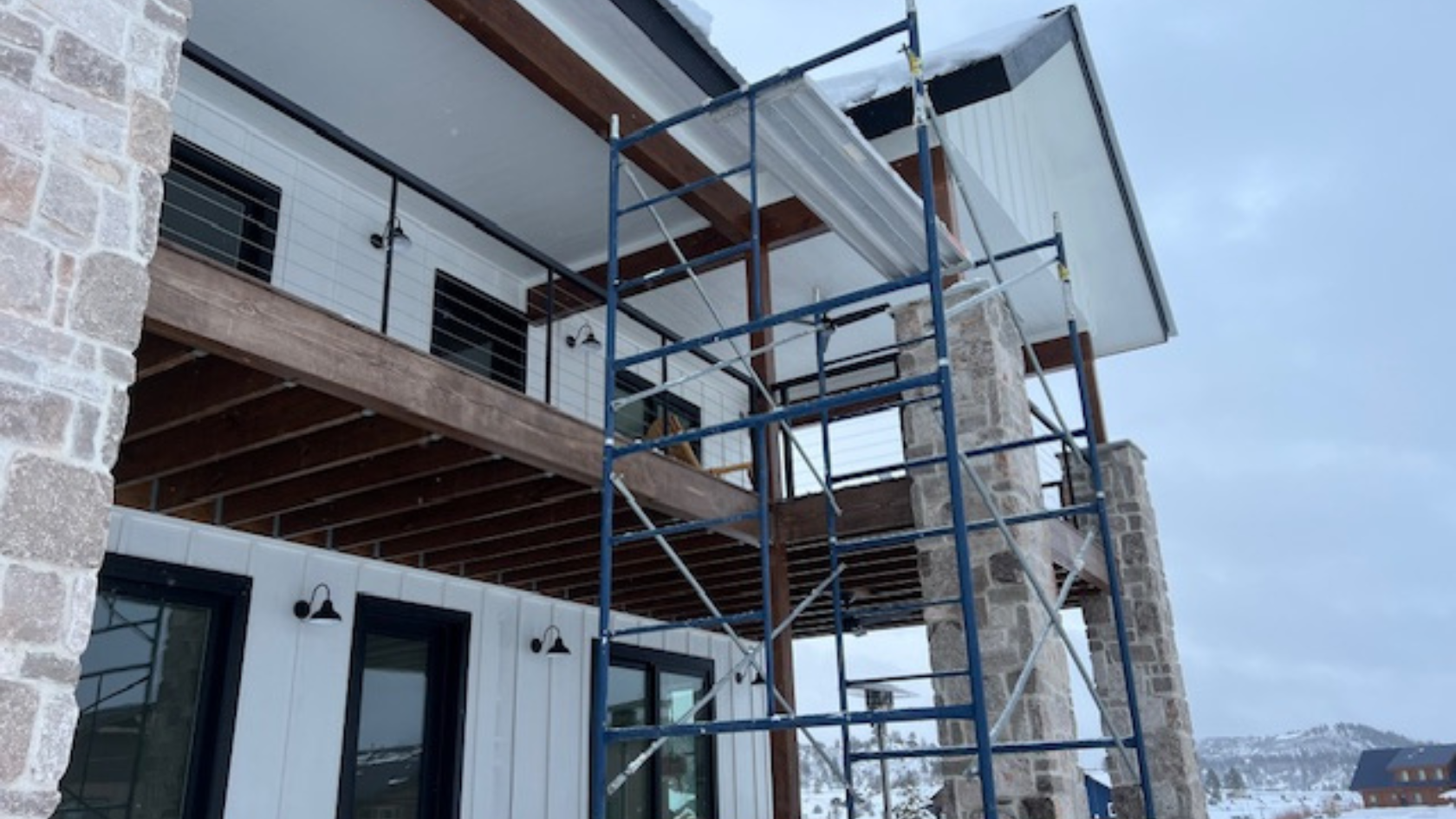 A house being built with scaffolding on the side of it